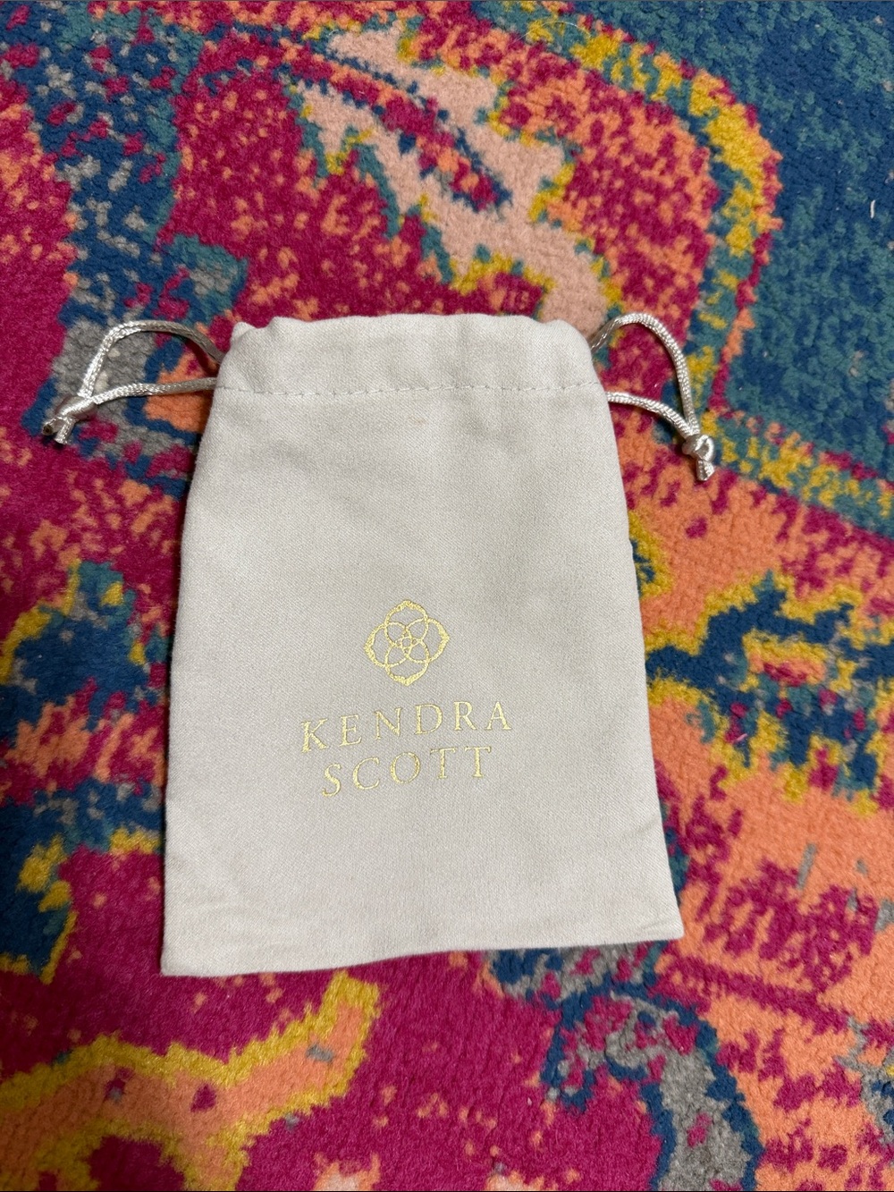 Kendra Scott Drawstring Jewelry Pouch in Light Cream with Gold Logo